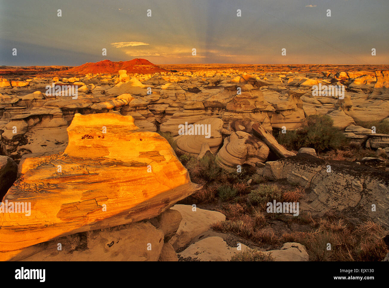 A sunset seems especially eerie and majestic at the Bisti Wilderness Recreation Area near Farmington, New Mexico. Stock Photo
