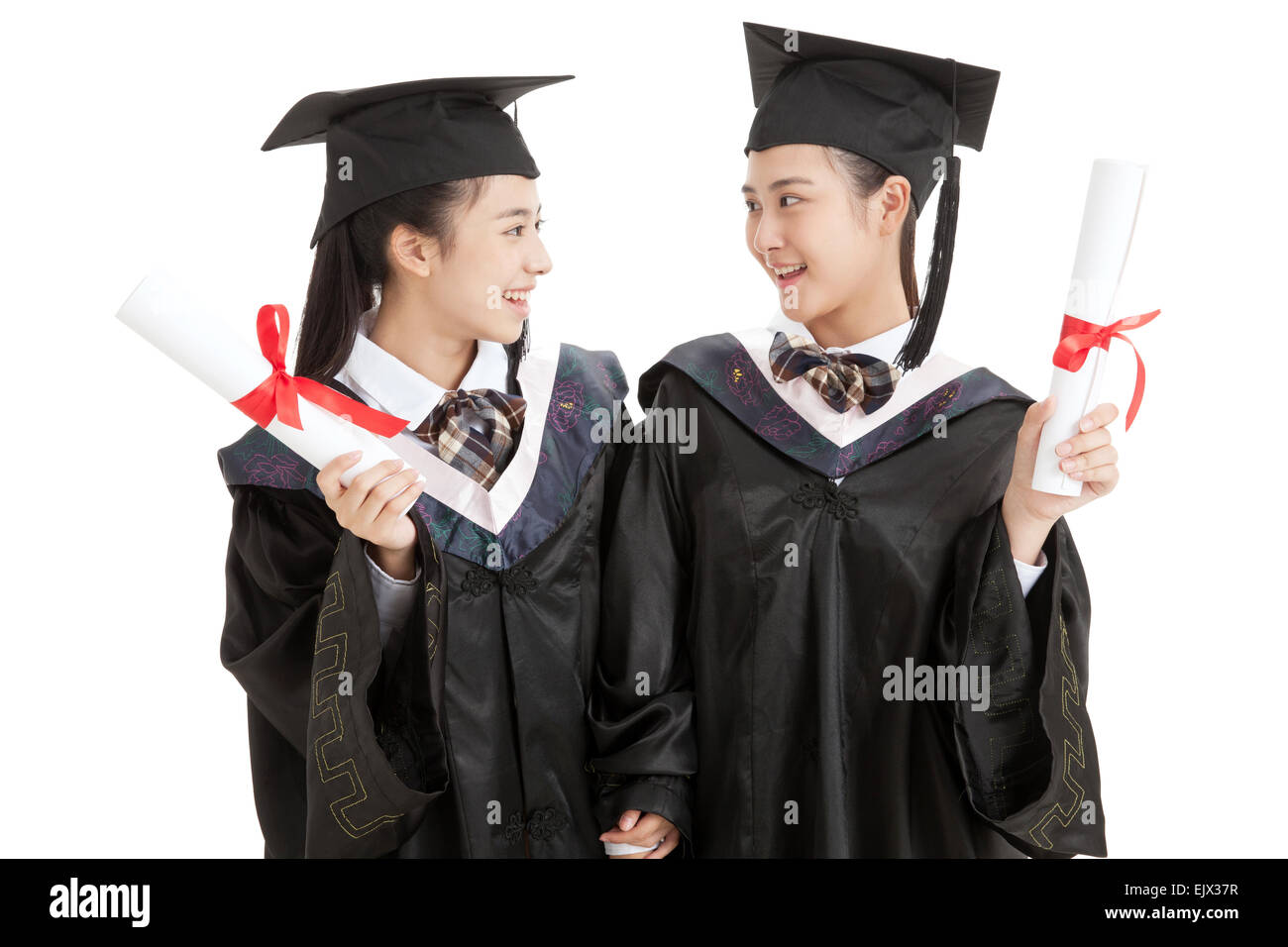 Two high school girls wearing gown Stock Photo - Alamy