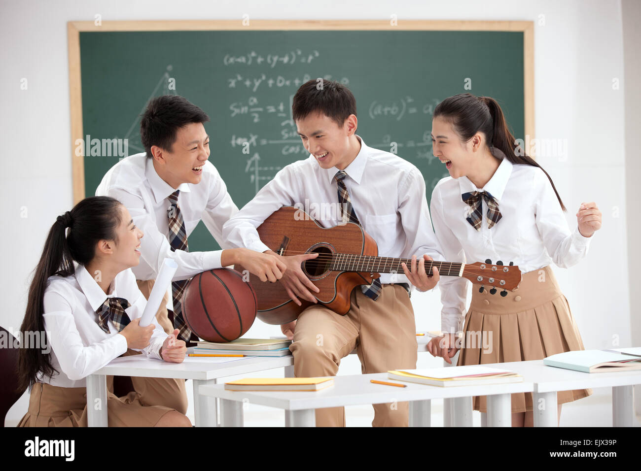 High school students to play the guitar in the classroom Stock Photo Alamy