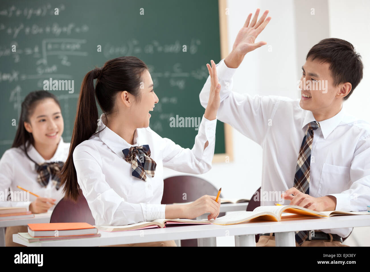 The excitement of the high school students do clap gesture in the classroom Stock Photo