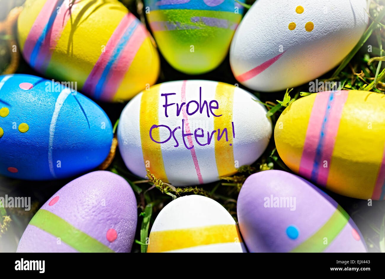 Colorful Easter eggs and German Easter Greeting Stock Photo