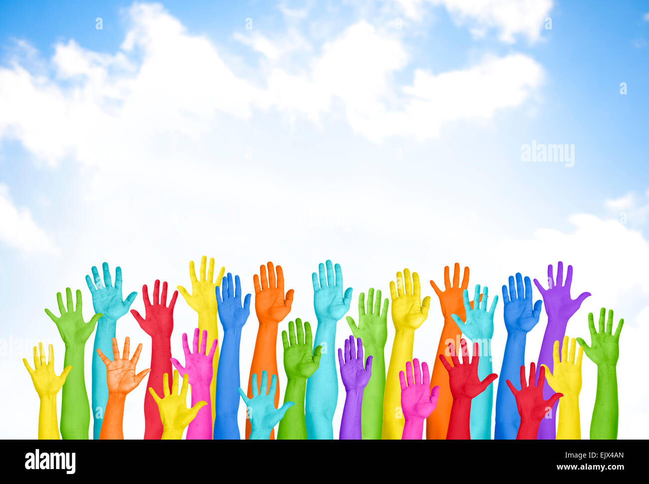 Colorful Hands Raised With Blue Sky Stock Photo - Alamy
