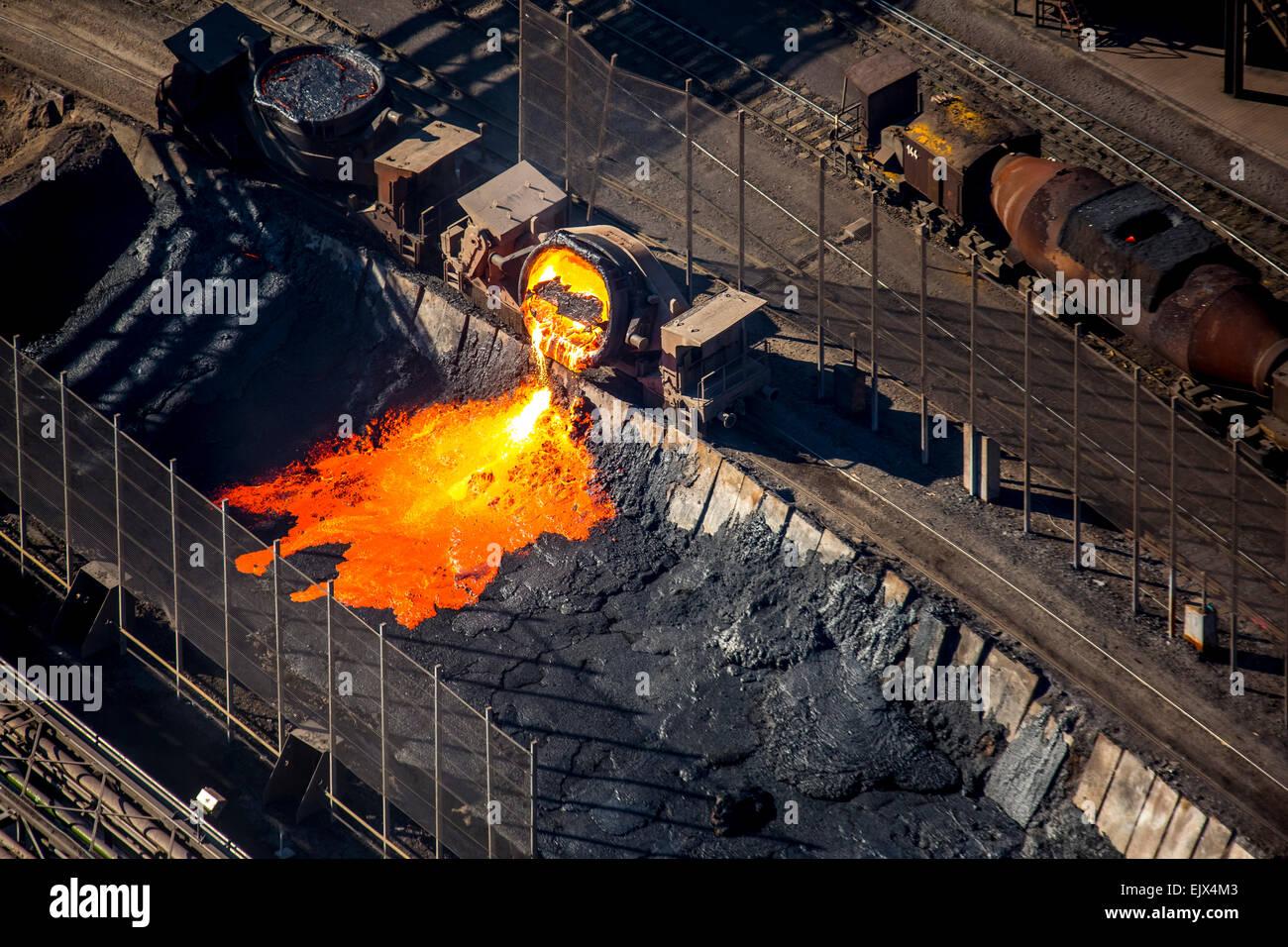 Hot iron production slag being poured from a barrel into a pit in the steel mill TKS ThyssenKrupp Steel, Bruckhausen, Duisburg Stock Photo
