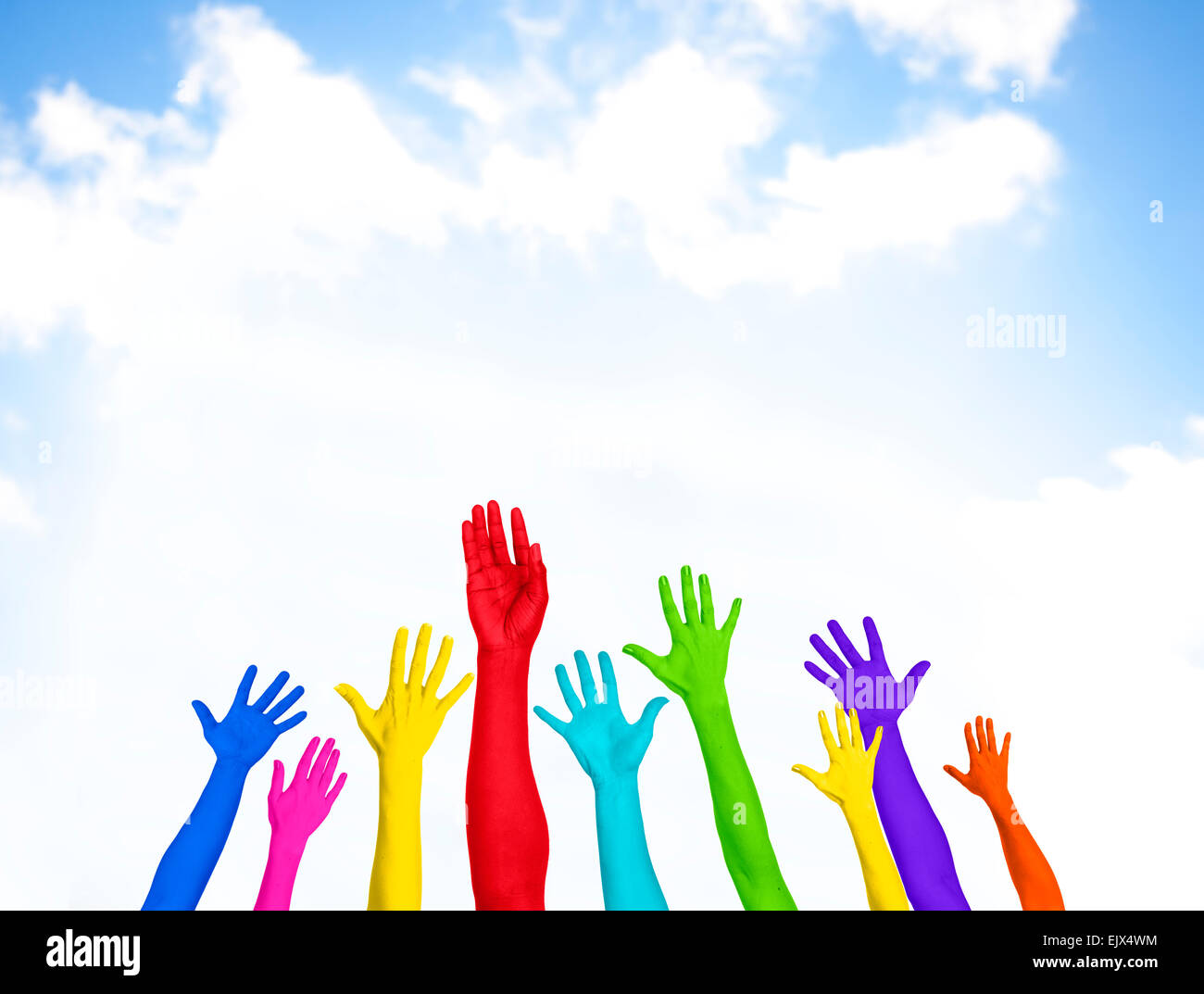 Colorful Hands Raised With Blue Sky Stock Photo - Alamy