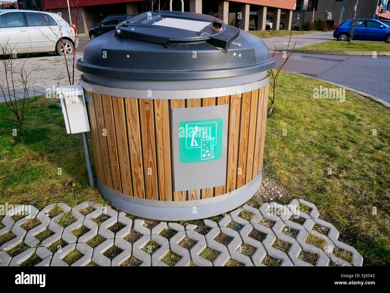 Modern locked green ecological trash bin in the new residential city