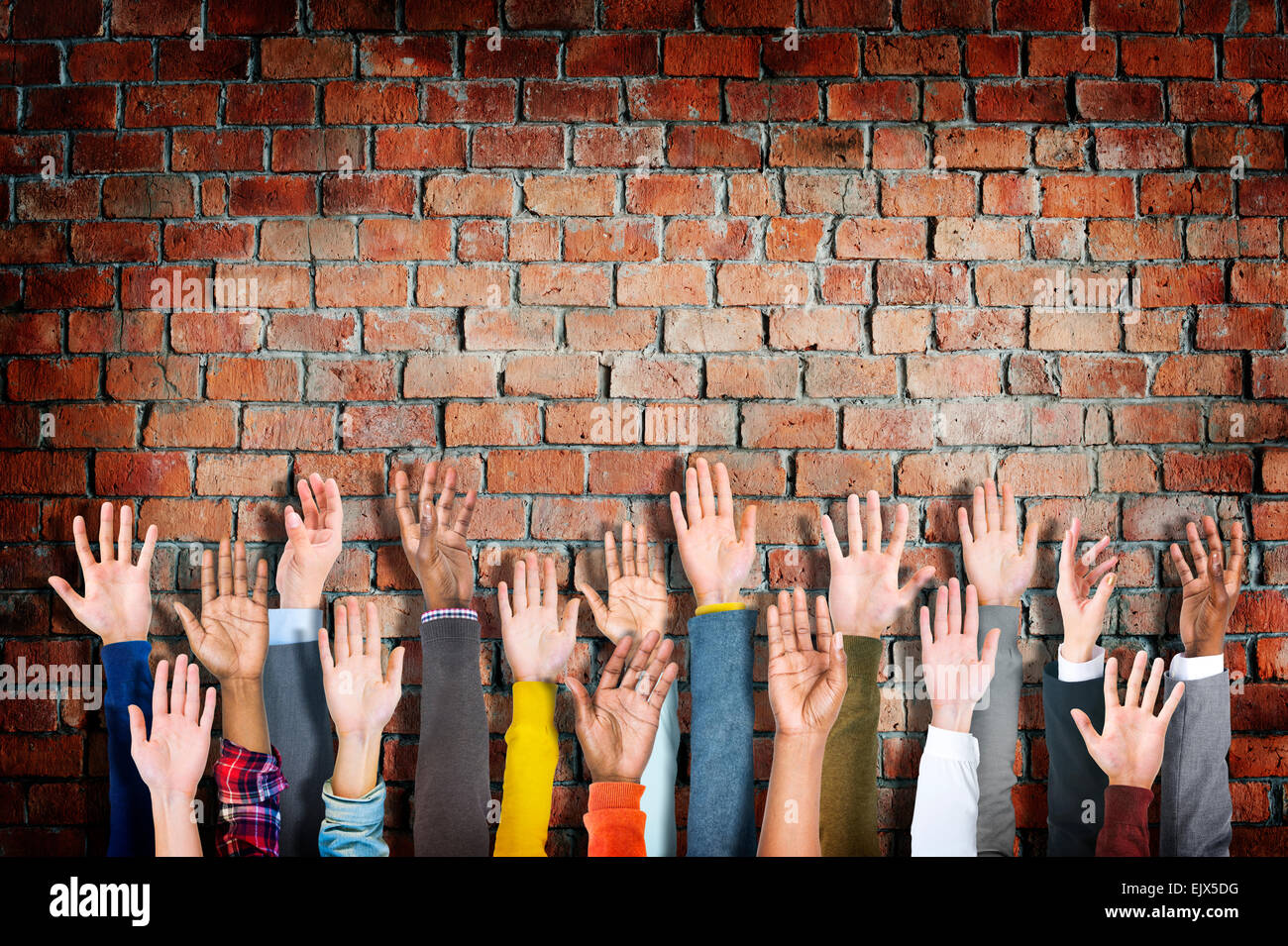 Group of Diverse People's Hands Raised Stock Photo