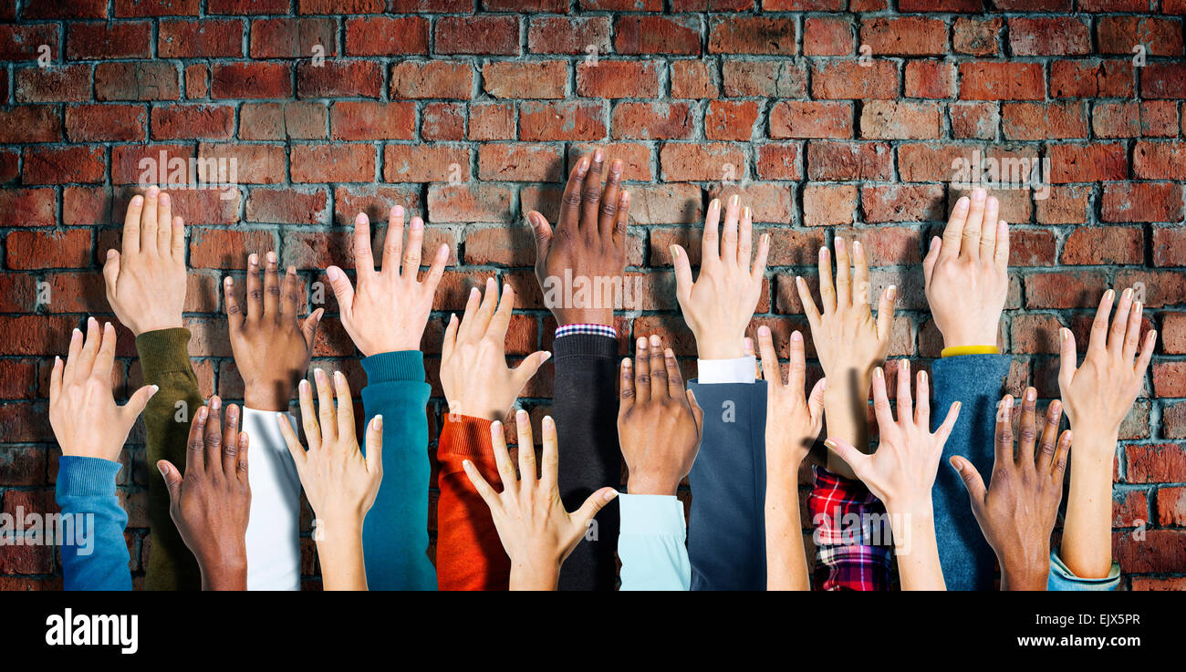 Group of Diverse People's Hands Raised Stock Photo