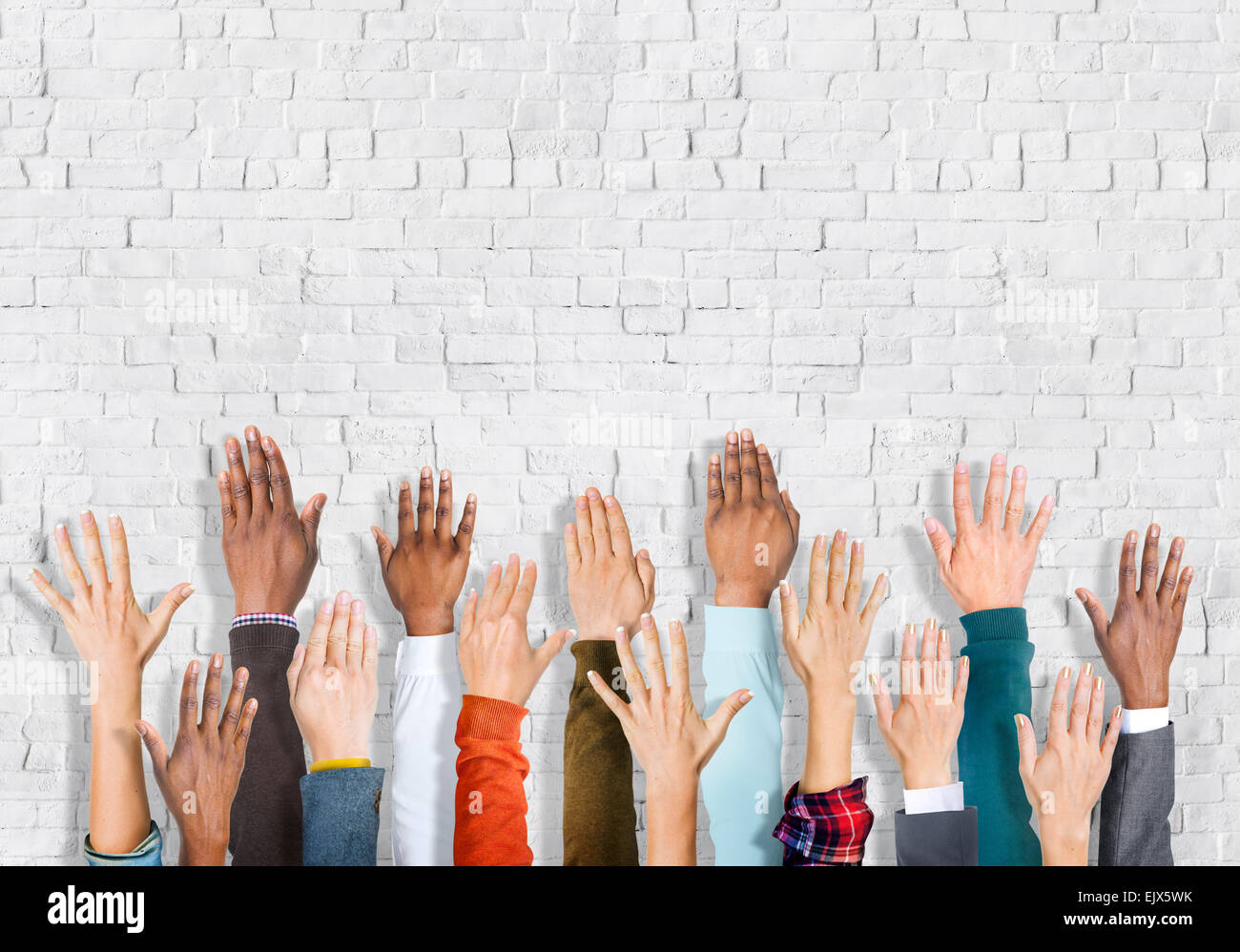 Group of Multiethnic Diverse Hands Raised Stock Photo