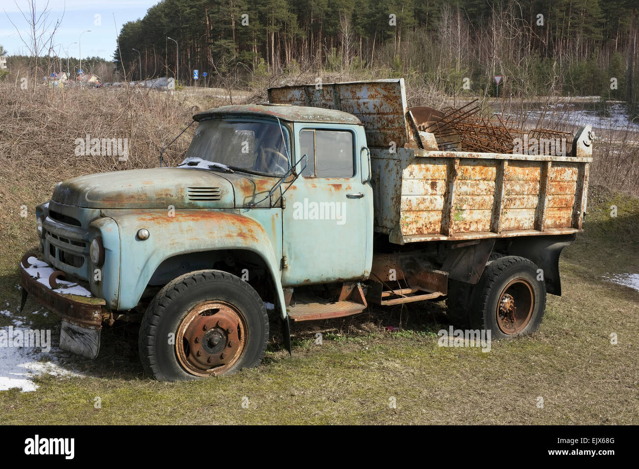 The old rusty forgotten soviet mass production  truck of the middle of the twentieth century waits for utilization Stock Photo