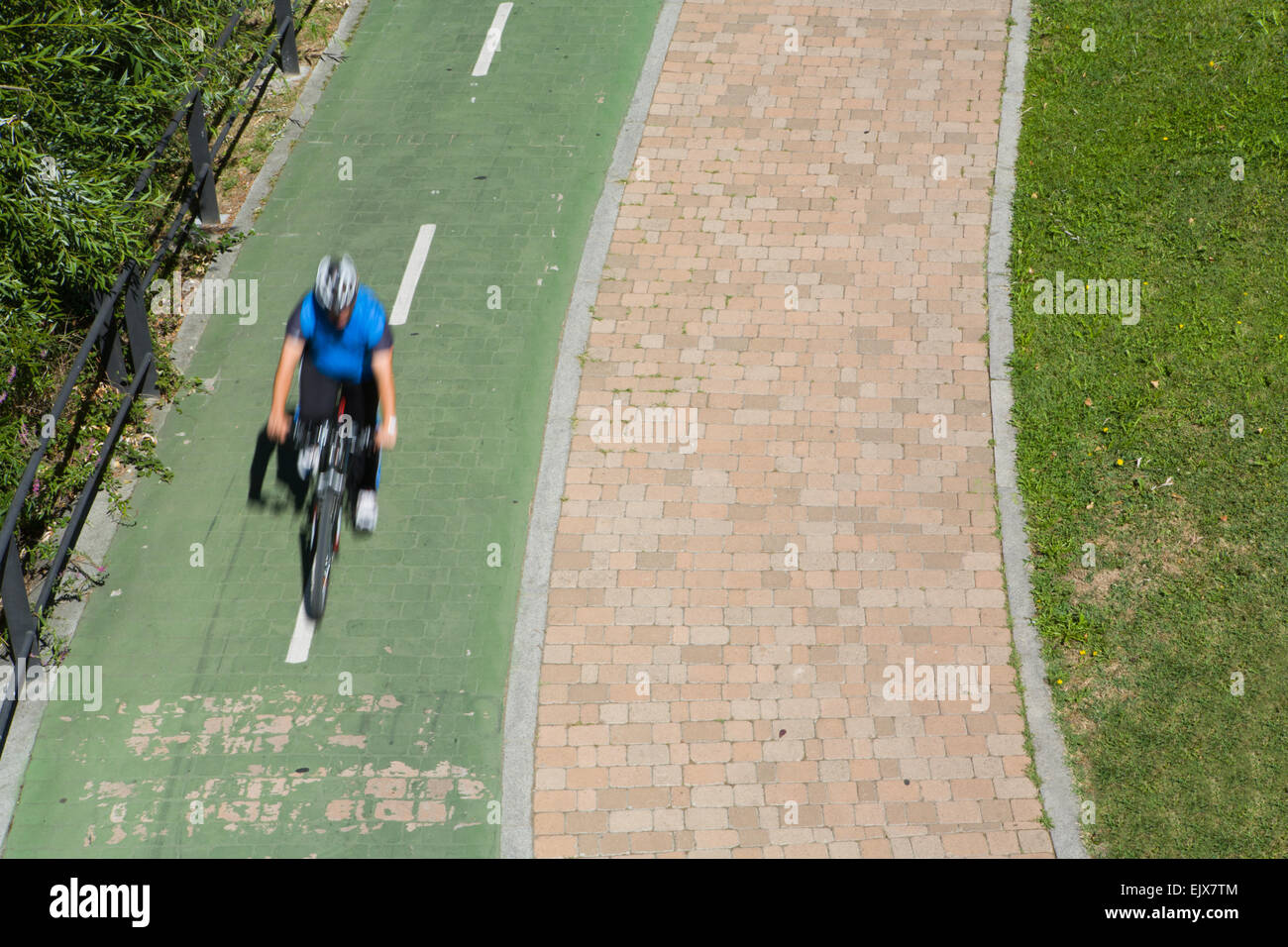 Man with helmet on bike on the park, Salamanca, Spain Stock Photo