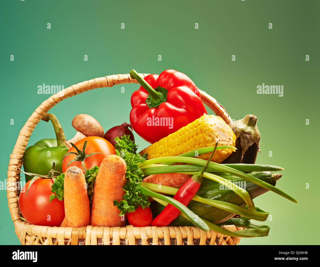 Vegetables in a wicker basket Stock Photo - Alamy