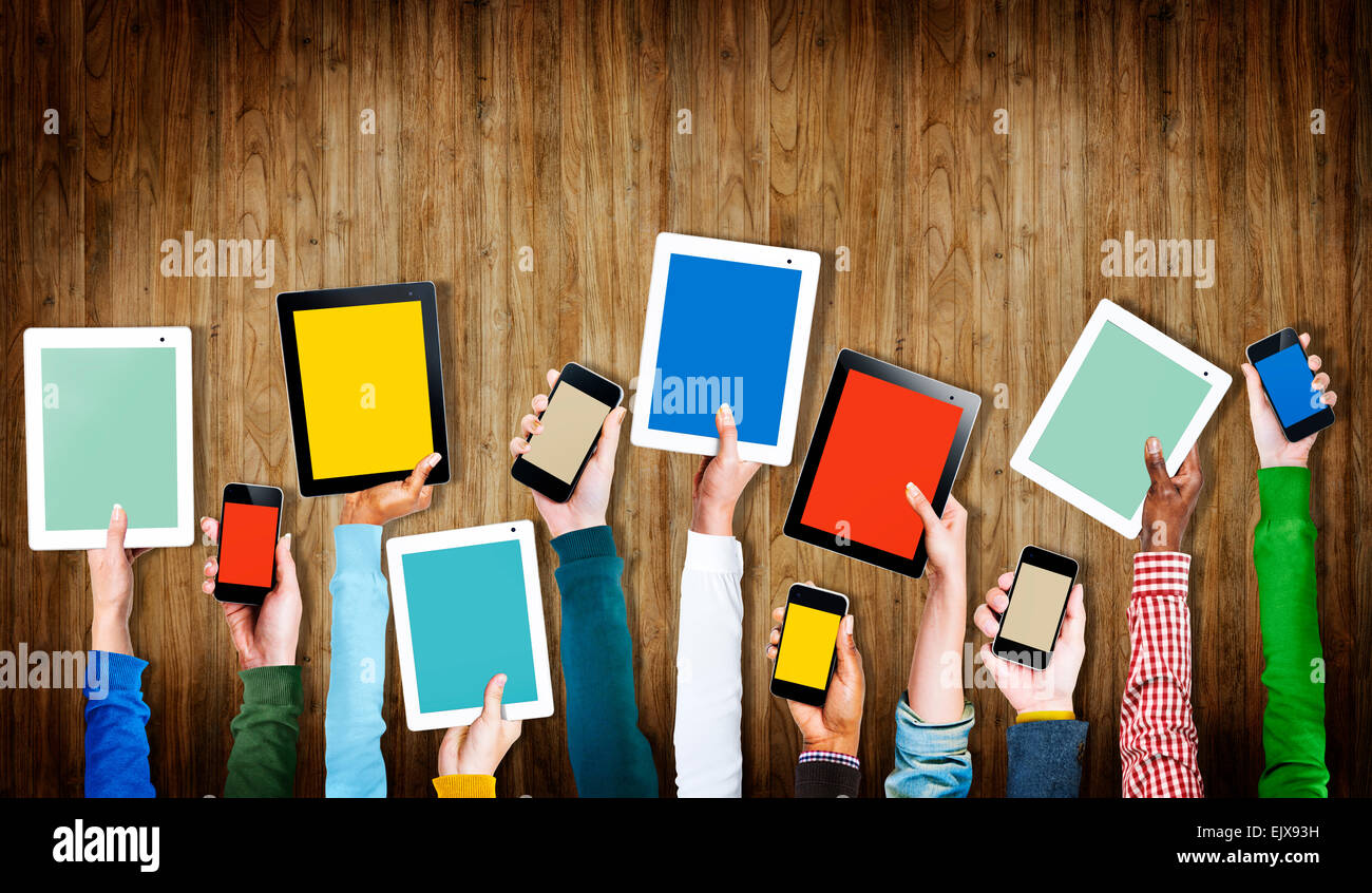 Group of Hands Holding Digital Devices with Copy Space Stock Photo - Alamy