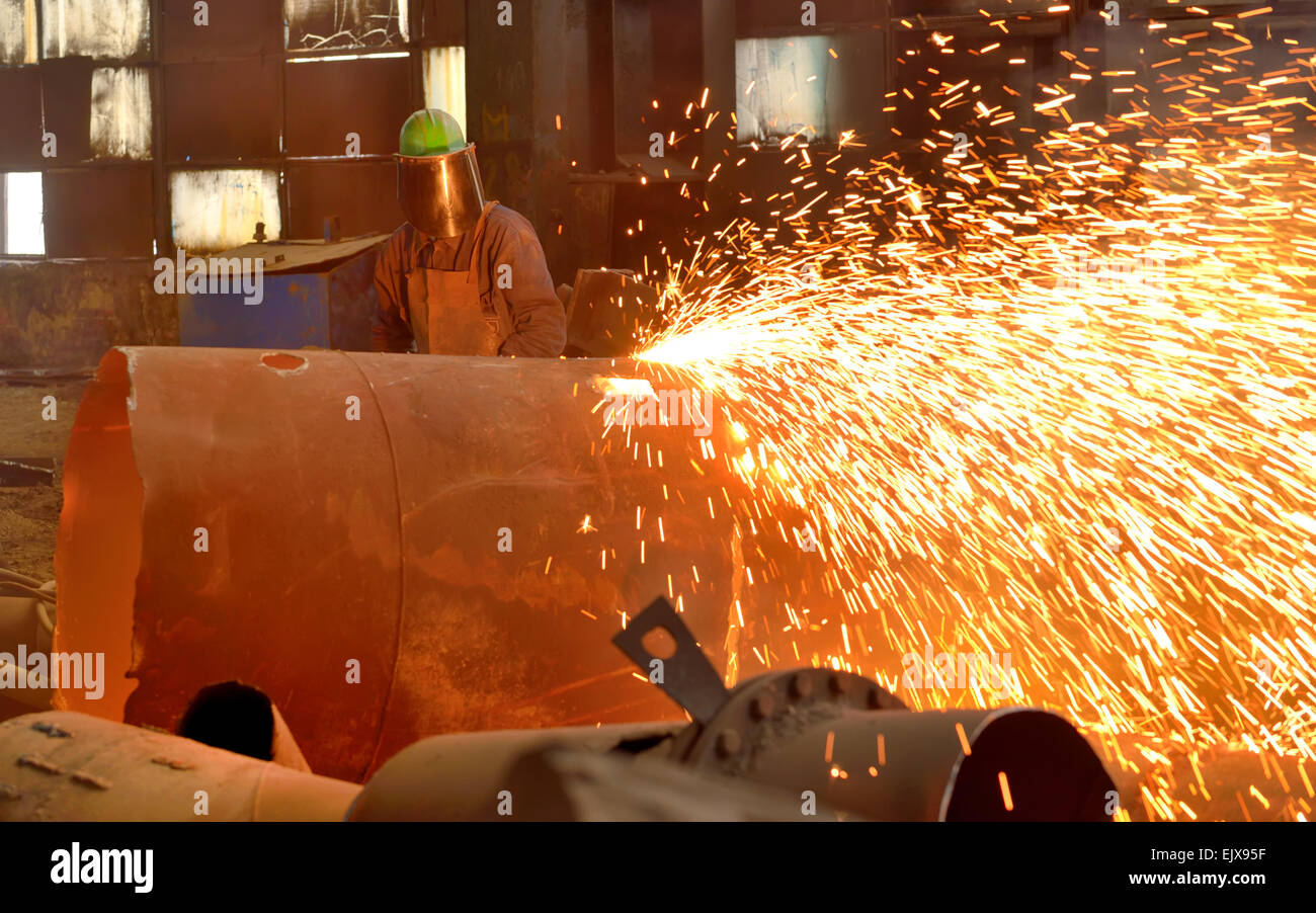worker using torch cutter to cut through metal Stock Photo Alamy