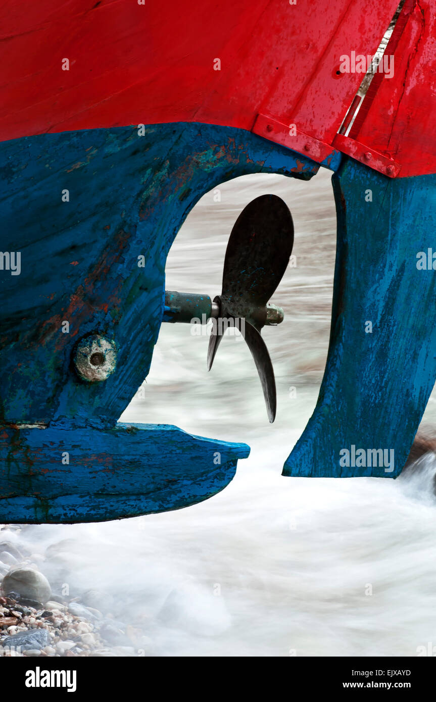 Greek Rudder Propeller and rudder of a Greek fishing boat lying on a beach Stock ...