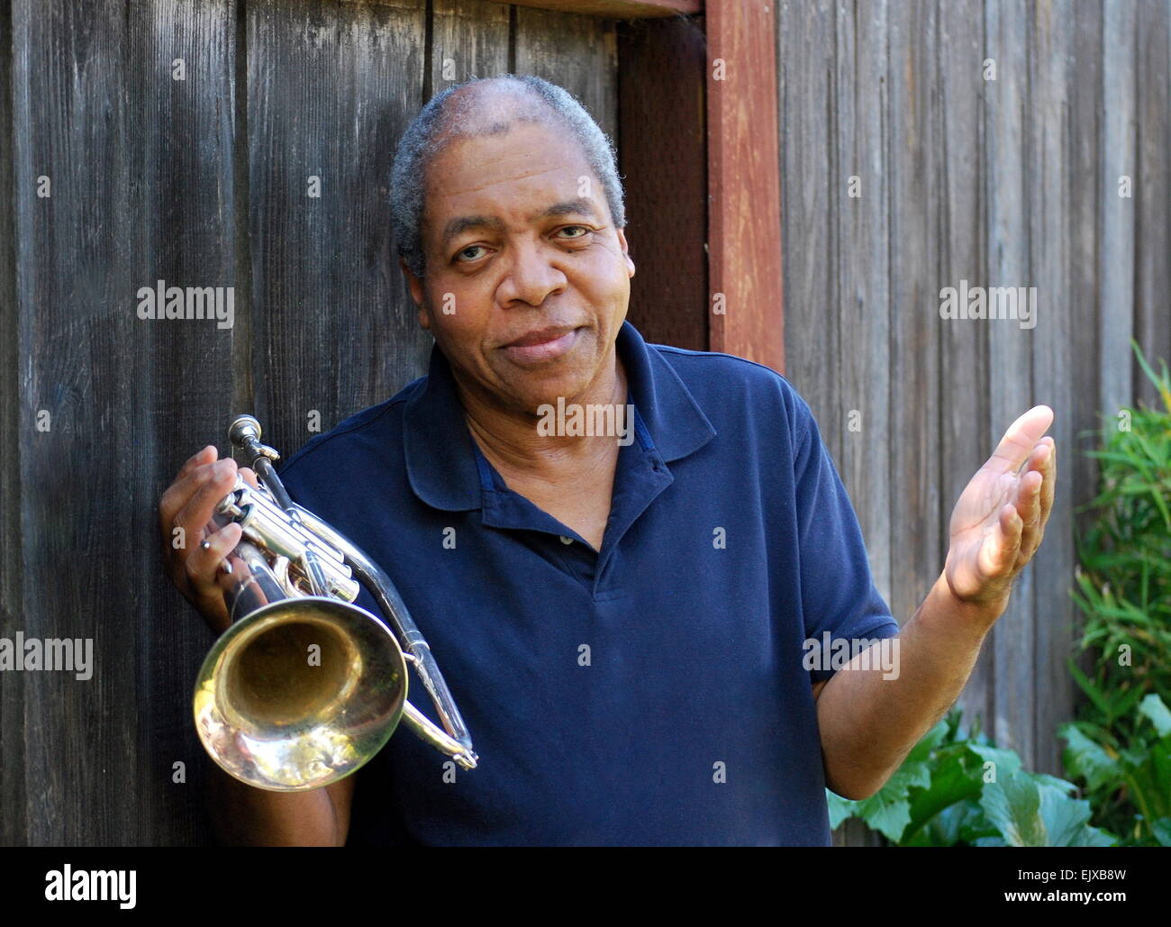 Jazz musician expressions outside with his flugelhorn Stock Photo Alamy