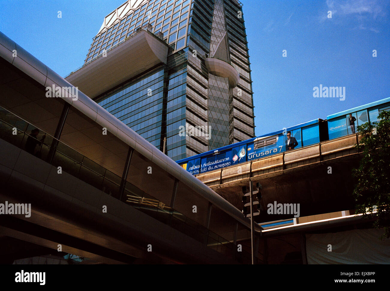 BTS train amongst the modern skyscrapers of Sukhumvit in Bangkok in Thailand in Far East Southeast Asia. Skyscraper Tower Urban City Cities Travel Stock Photo
