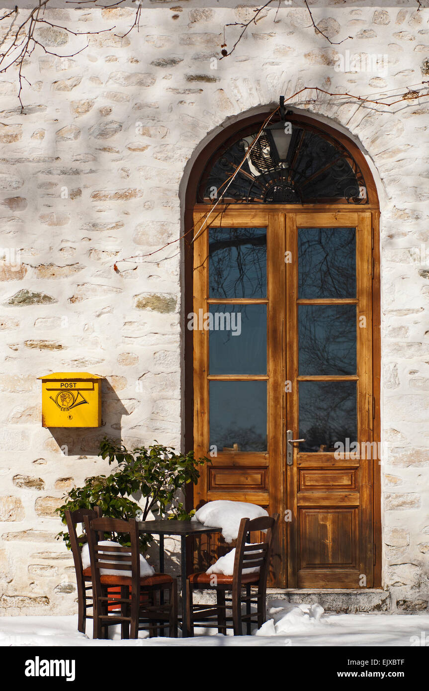 Snowy village scene with letterbox on Pelion Peninsula, Thessaly, Greece Stock Photo