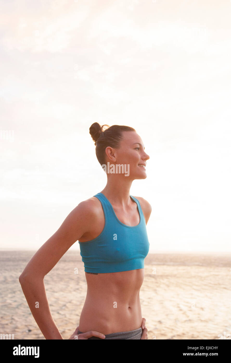 Woman on Beach in Blue Sport Bra Stock Photo Alamy