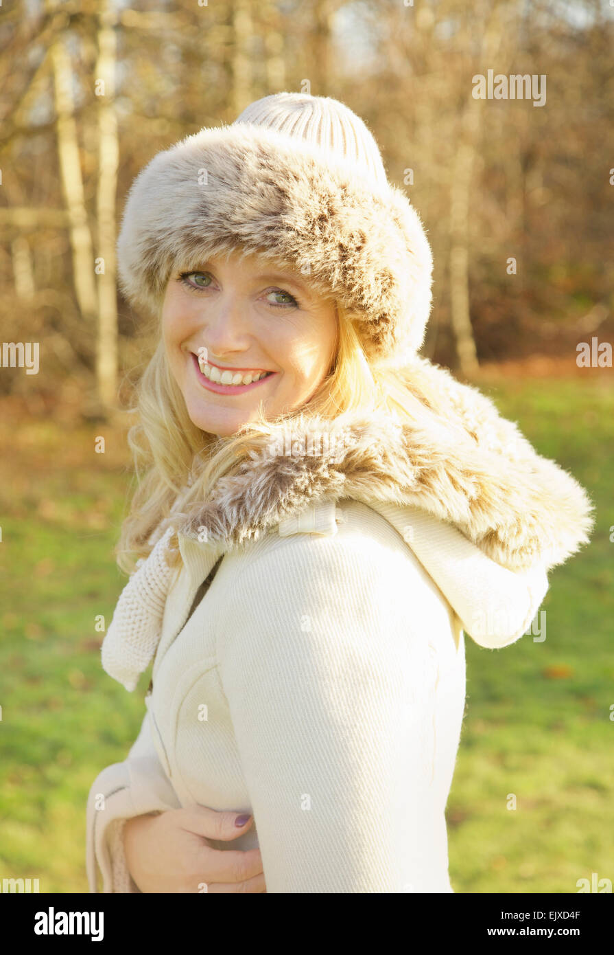 Woman Wearing Fur Trim Hat Outdoors Stock Photo