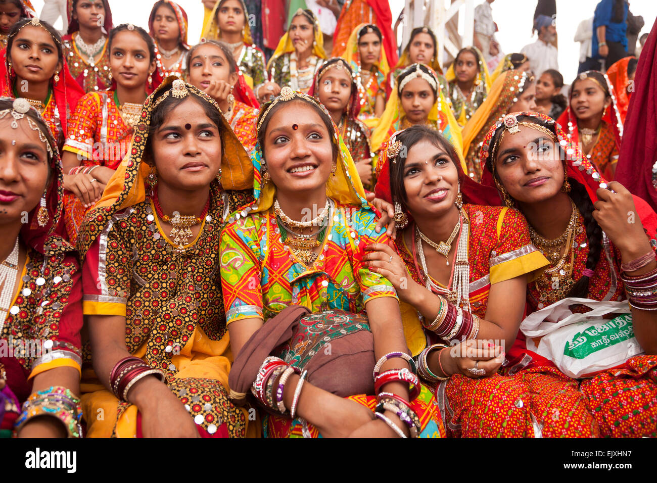 India, Rajasthan, Pushkar, young women at camel market Pushkar Mela ...