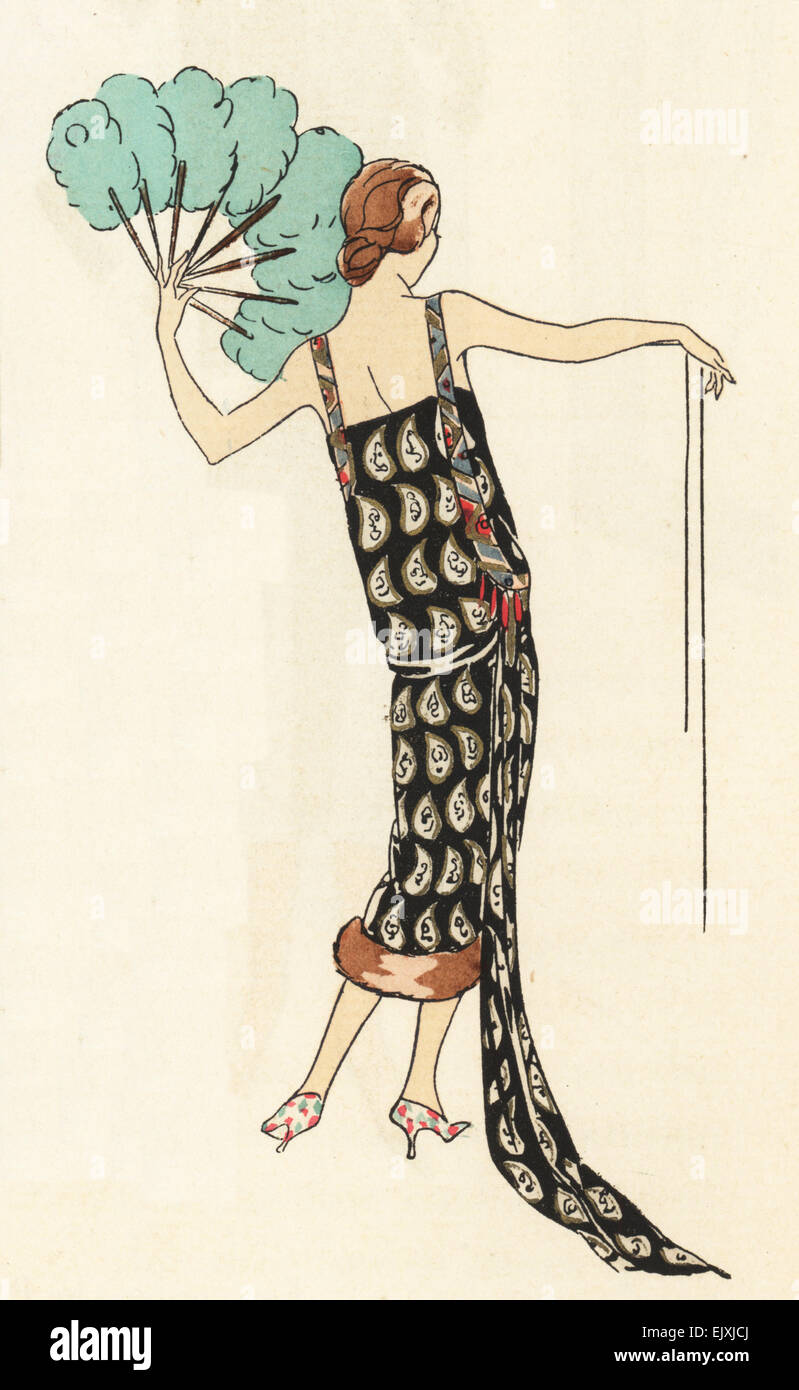 Evening dress in silver and gold lame on black trimmed with coral beads,  1925 Stock Photo - Alamy