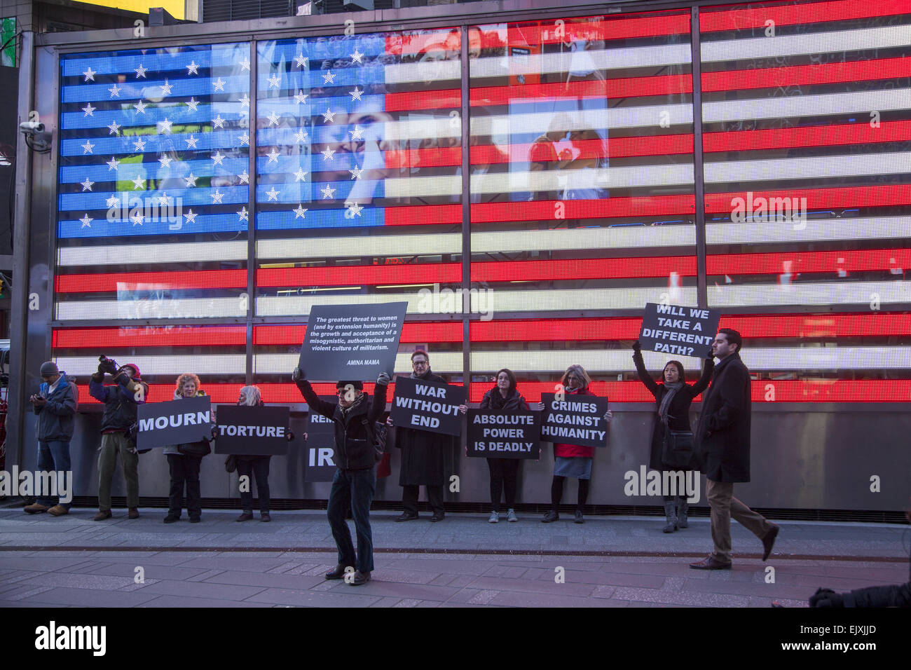 Antiwar peace activists line up at the military recruitment center in Times Square to remind people of the American act of war o Stock Photo