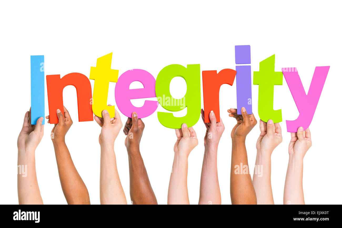Multi-Ethnic Group Of People's Arms Raised Holding Letters That Form Integrity Stock Photo
