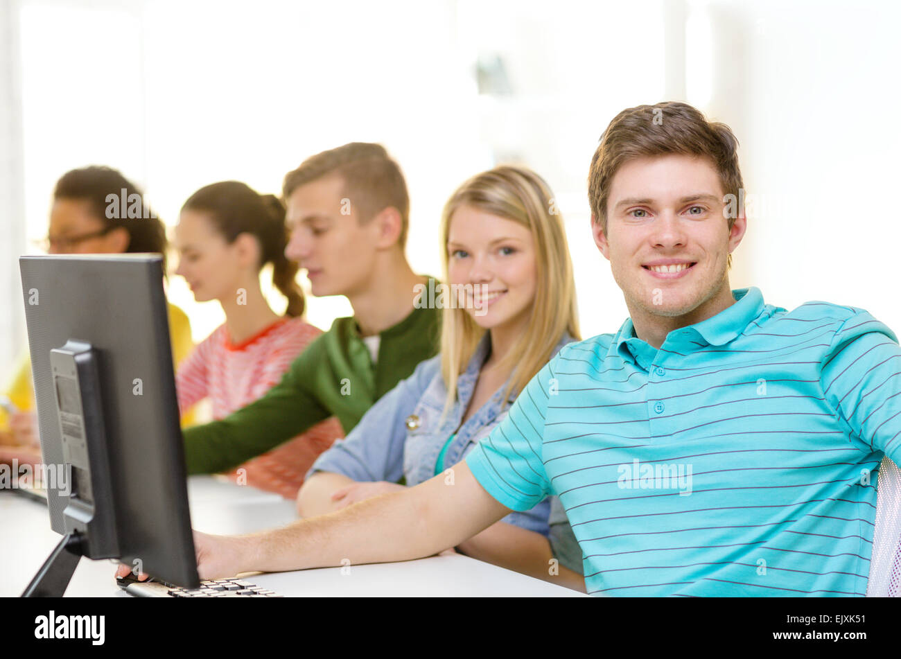 male student with classmates in computer class Stock Photo - Alamy