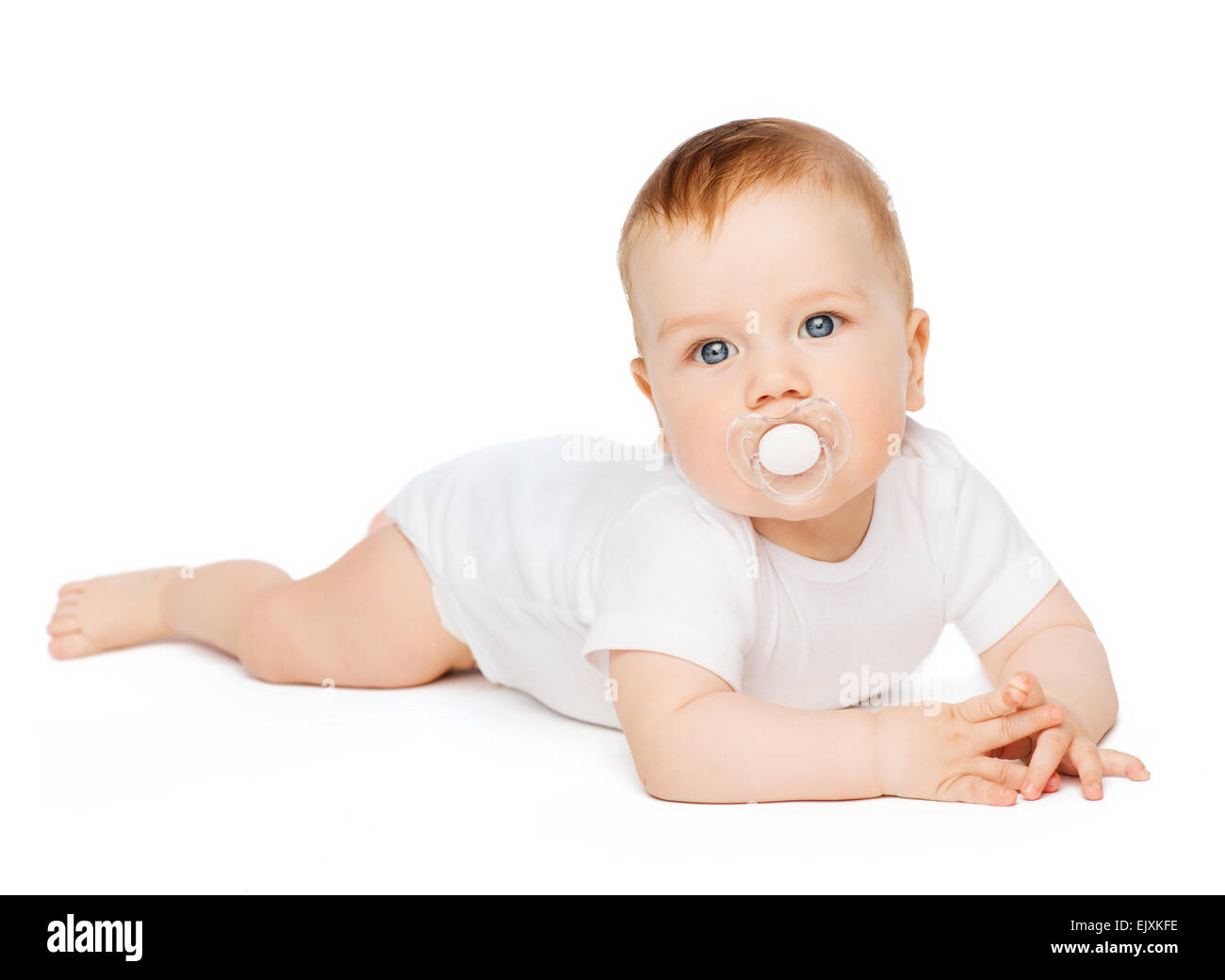 smiling baby lying on floor with dummy in mouth Stock Photo Alamy