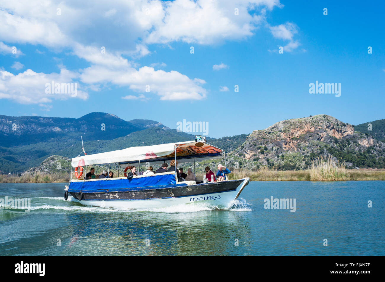 Tourist cruise boat on Dalyan River delta, Mugla Province, Aegean Region, Turkey Stock Photo