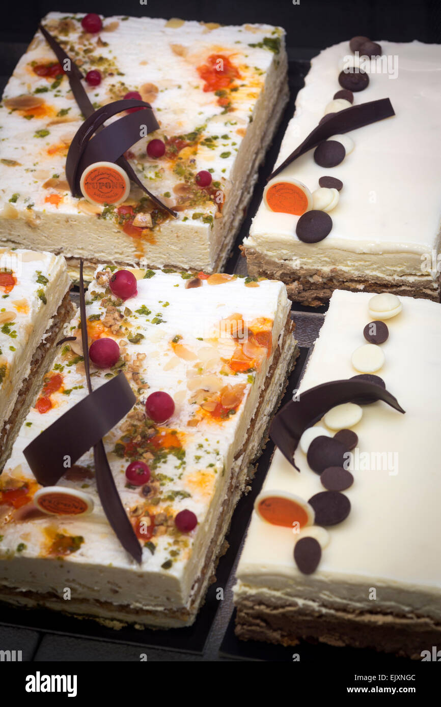 The display of pastries in cake shop window (France). Desserts exposés dans la vitrine d'une pâtisserie (France). Stock Photo