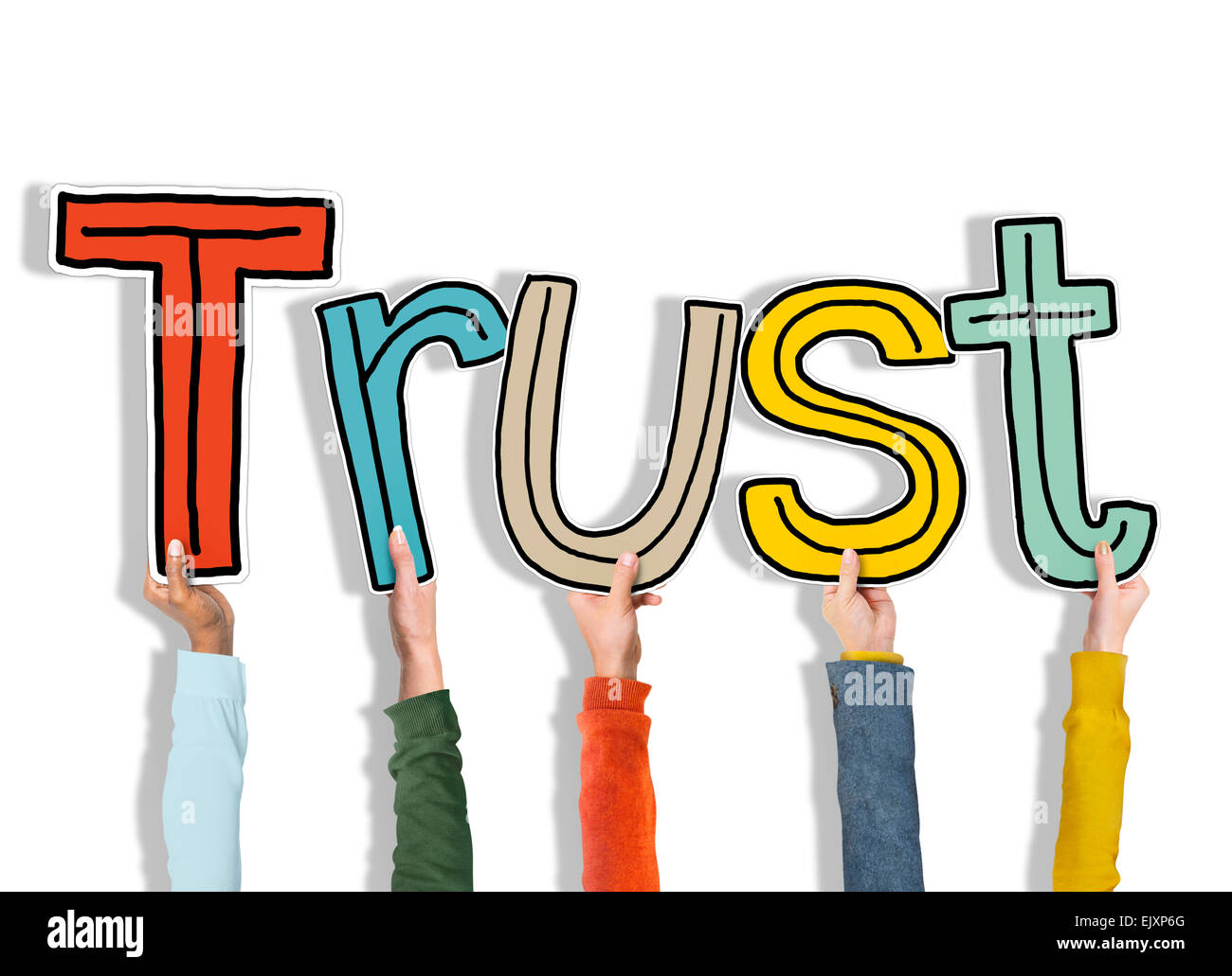Group of Hands Holding Letter Trust Stock Photo