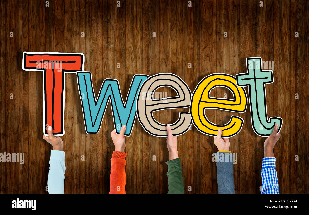Group of Hands Holding Letter Tweet Stock Photo - Alamy