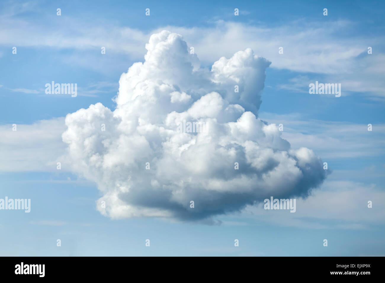 Unusual shaped cloud against the blue sky. Stock Photo