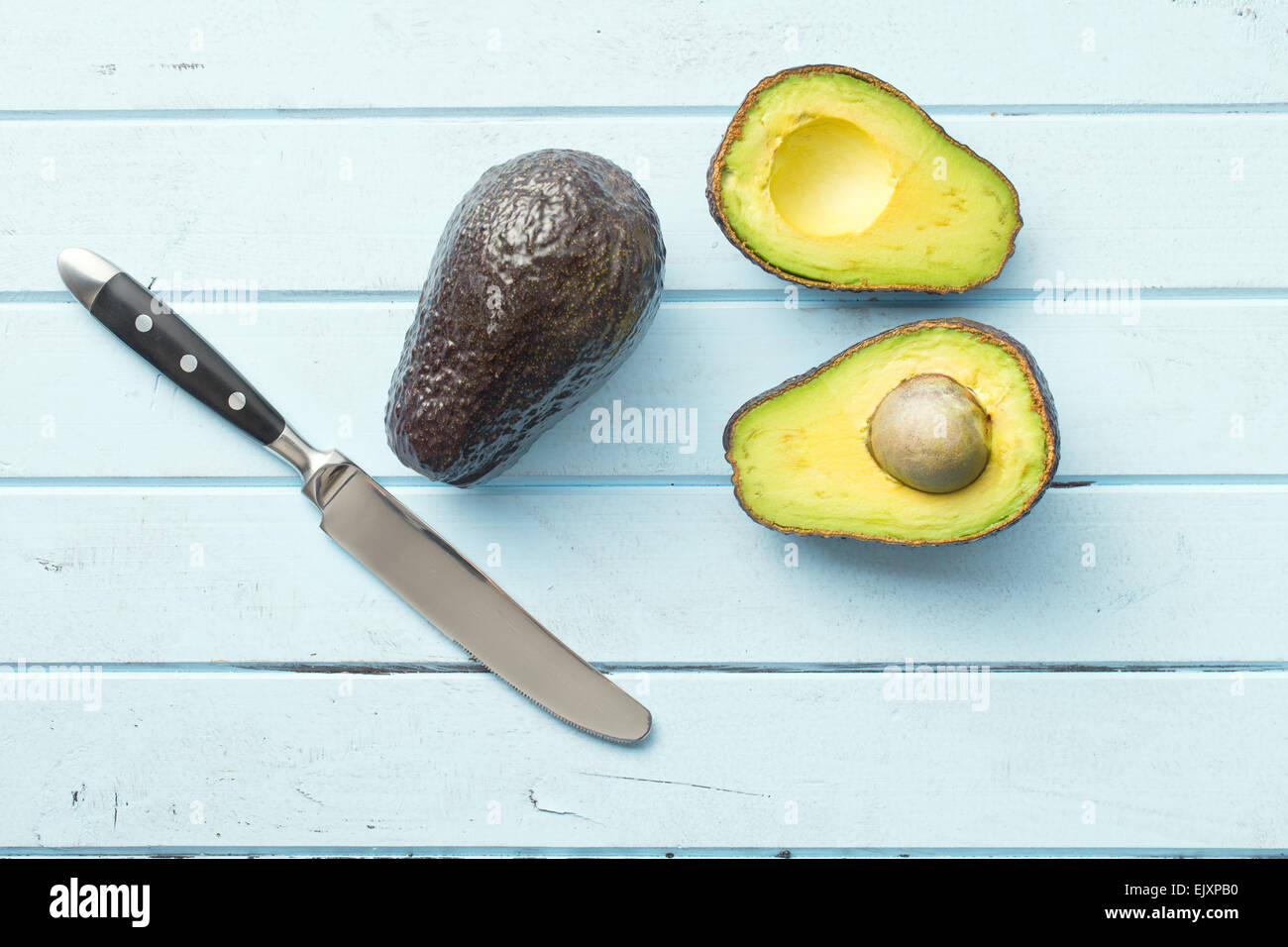 top view of halved avocado on table Stock Photo - Alamy