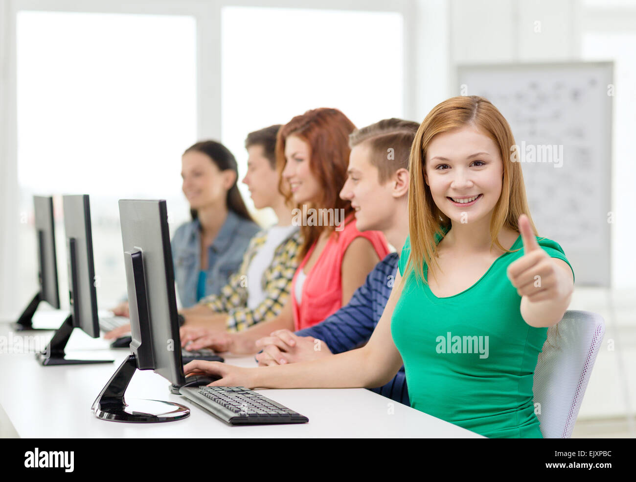female student with classmates in computer class Stock Photo - Alamy