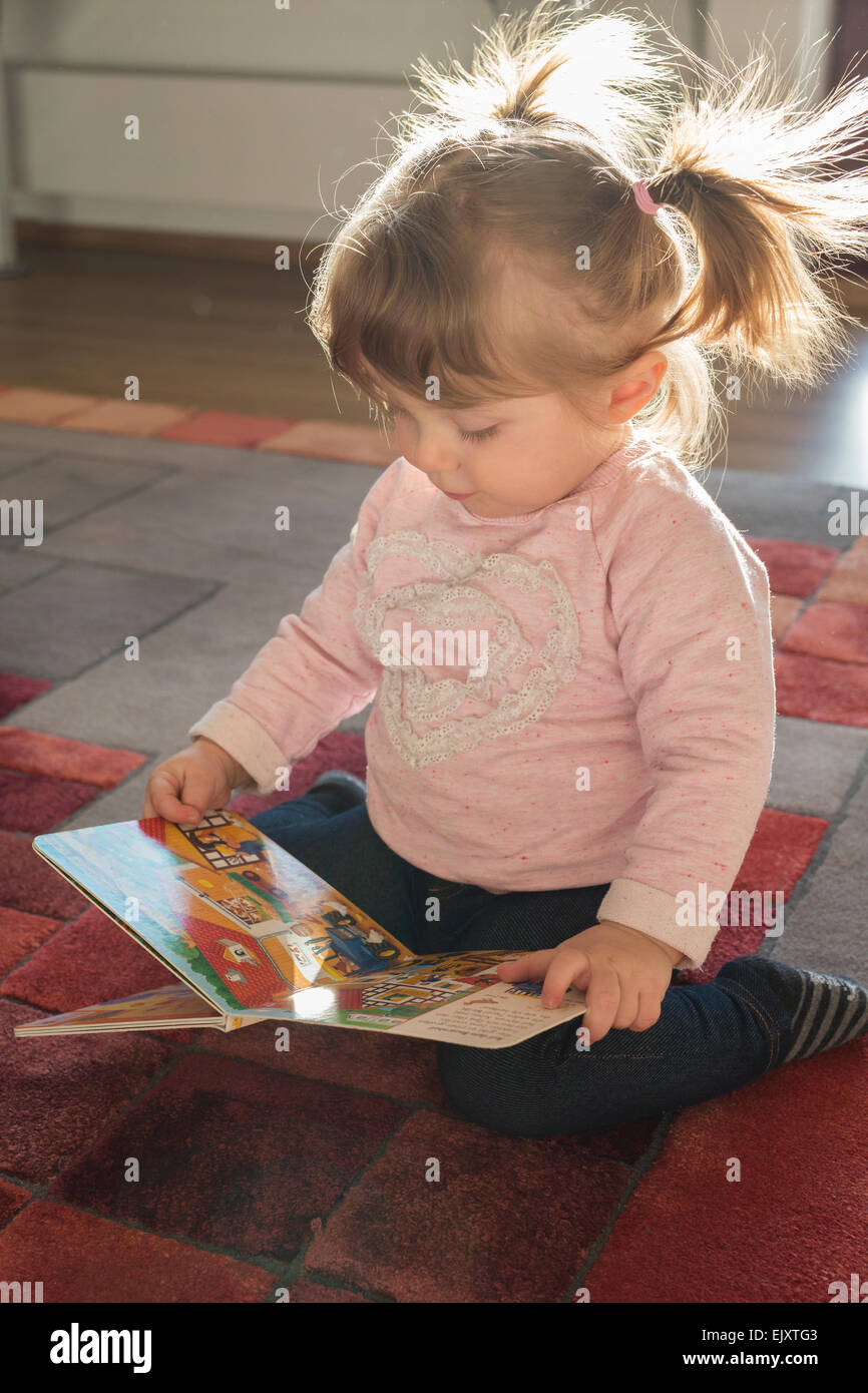 Little girl with picture book Stock Photo