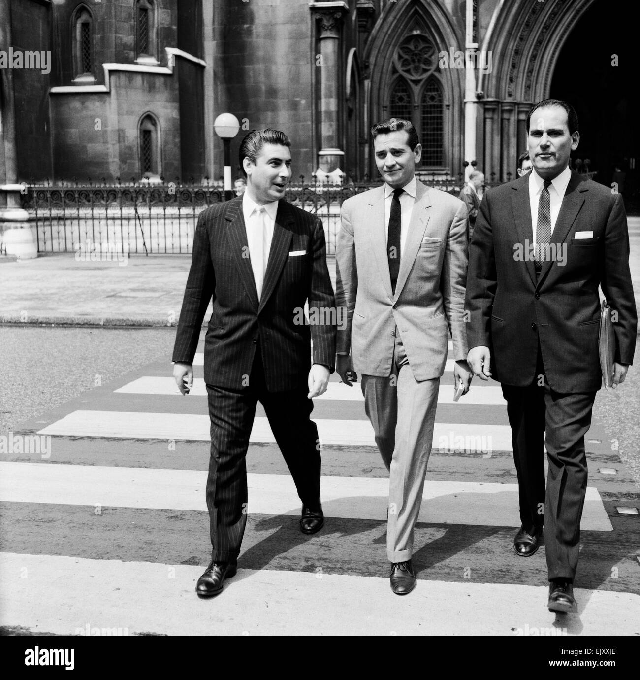 Larry Parnes (left) & John Kennedy (centre), managers of singer Tommy Steele, pictured arriving at court to attend liable action against a publishing company 7th July 1960. *** Local Caption *** Lawrence Parnes Manager Stock Photo