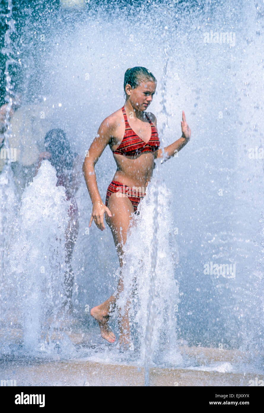 Young girl cooling off in a fountain Stock Photo Alamy