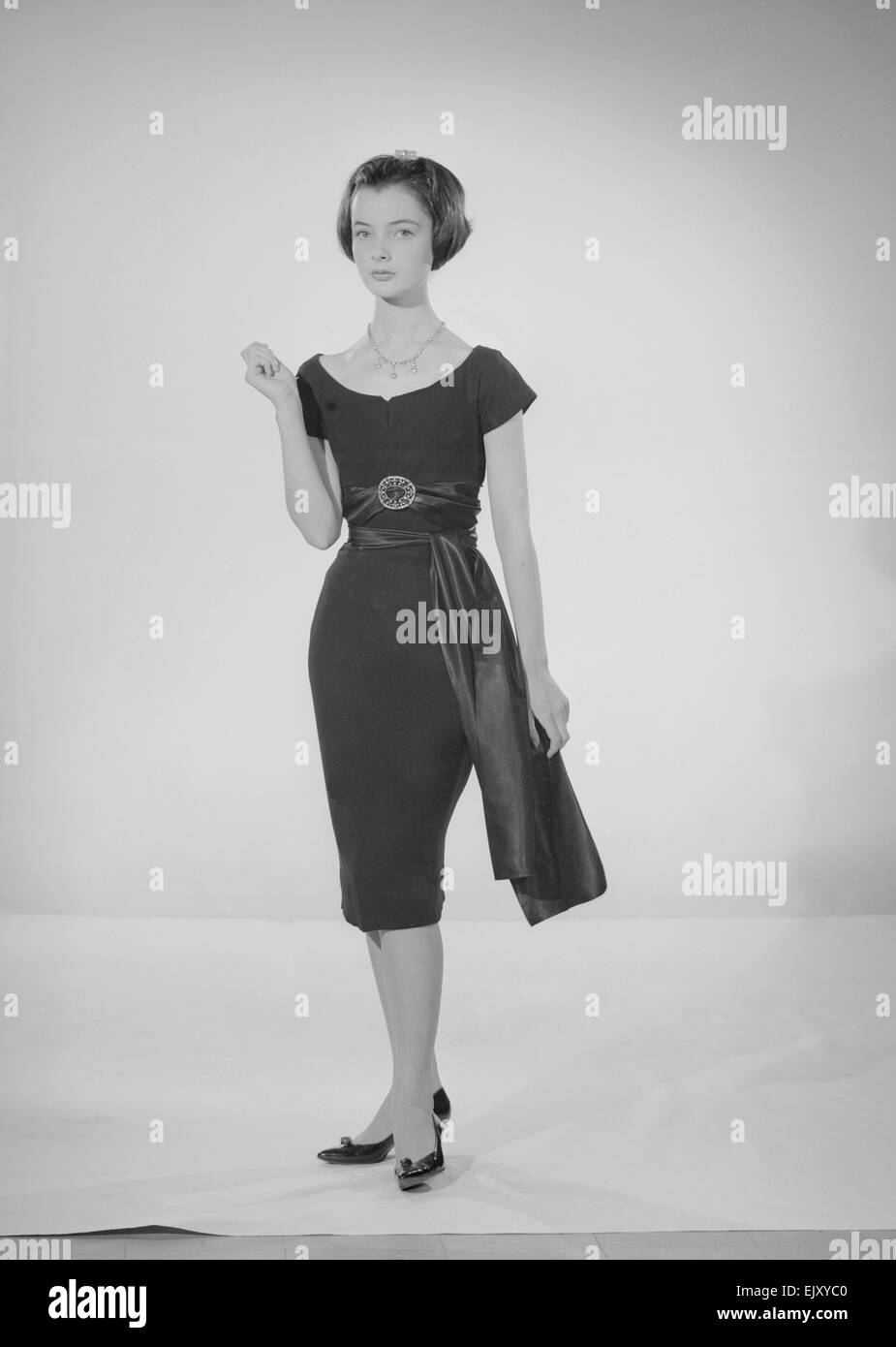 Model Jennifer Goddard. Young woman in short dressy black dress Stock ...