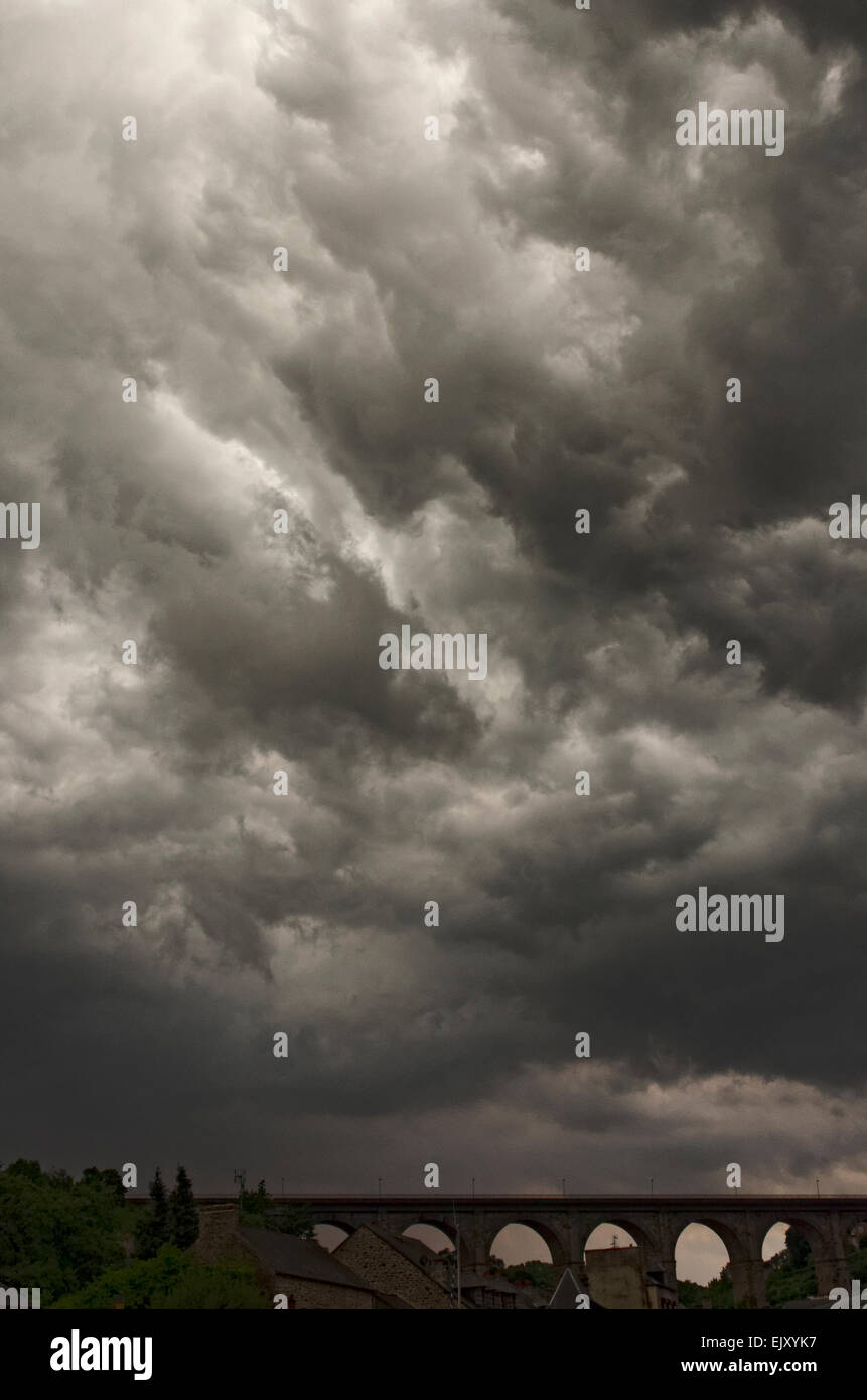 black boiling clouds over Dinan Brittany France as summer thunder storm approaches Stock Photo