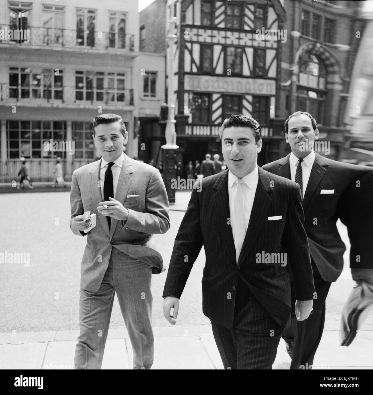 Larry Parnes (centre) & John Kennedy (left), managers of singer Tommy Steele, pictured arriving at court to attend liable action against a publishing company 7th July 1960. *** Local Caption *** Lawrence Parnes Manager Stock Photo