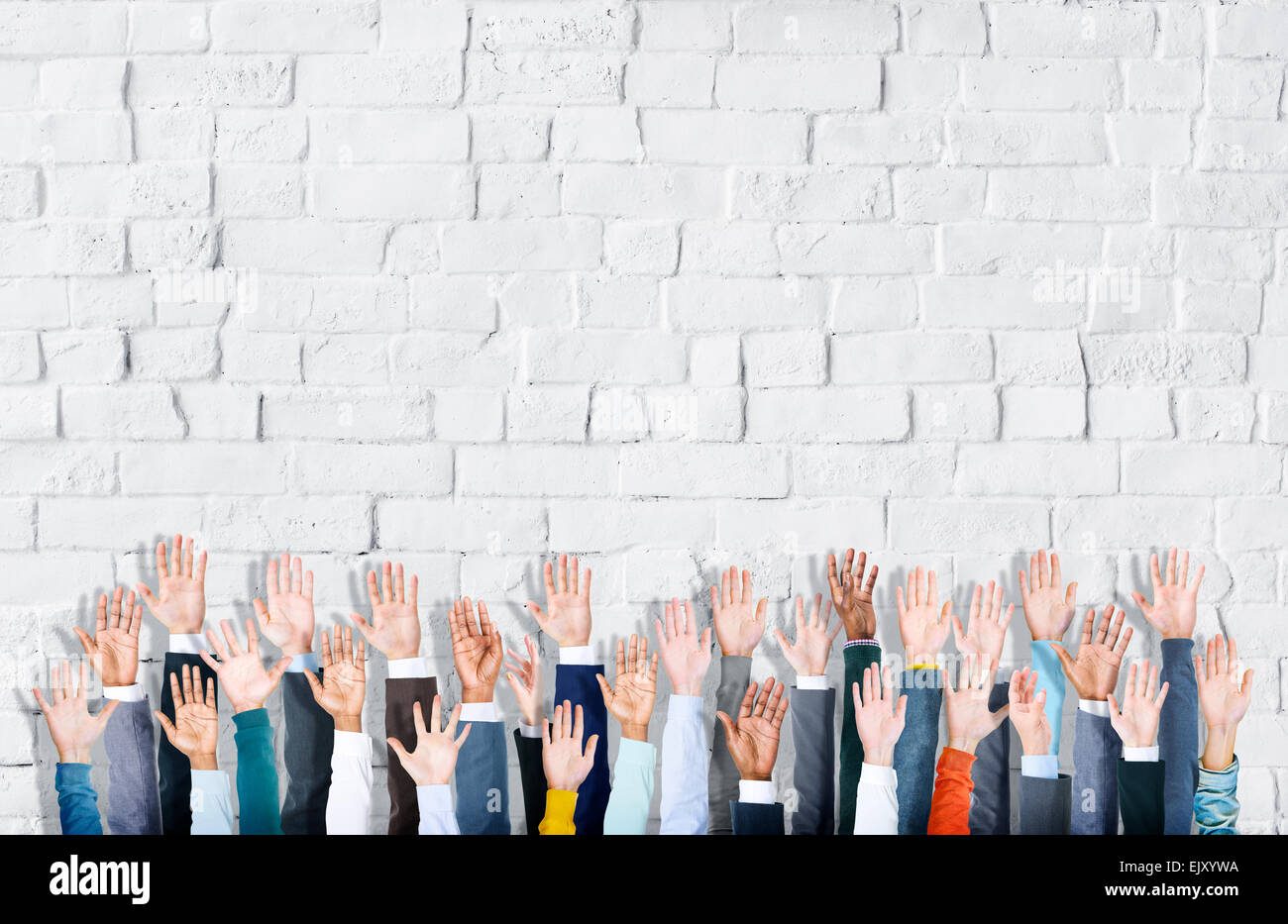 Multiethnic Group of Business Hands Raised Stock Photo - Alamy