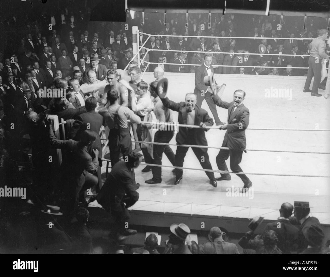 Joe Beckett and his supporters celebrate after knocking out Frank Goddard in the British Boxing Board of Control  British heavyweight title fight, at Olympia, Kensington, London, United Kingdom 17th June 1919 Stock Photo