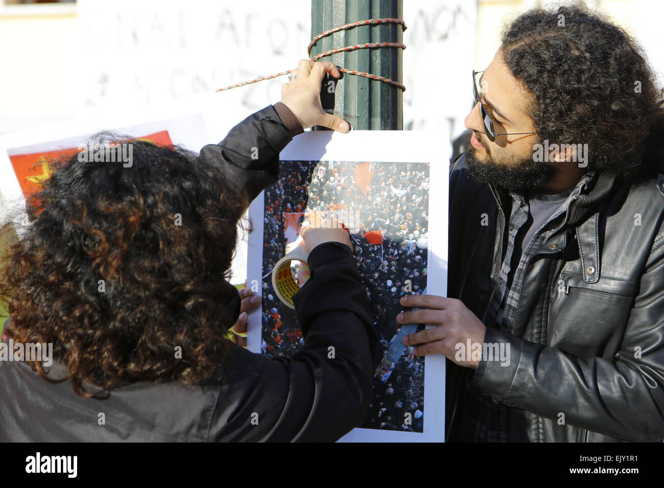 Athens, Greece. 2nd April 2015. A protester puts a picture from the funeral of 15 year old Berkin Elvan, who died after behind hid by a tear gas canister from the police, on to a lamp post. A handful of protesters showed their solidarity with the two killed activists who had taken a prosecutor hostage in a Istanbul court house. They were calling for the truth in the killing of 15 year old Berkin Elvan who died during the Gezi protests after being hit by a tear gas canister from the police. Credit:  Michael Debets/Alamy Live News Stock Photo
