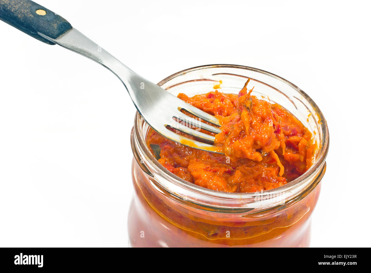 Roasted red peppers chutney on fork in a jar Stock Photo Alamy
