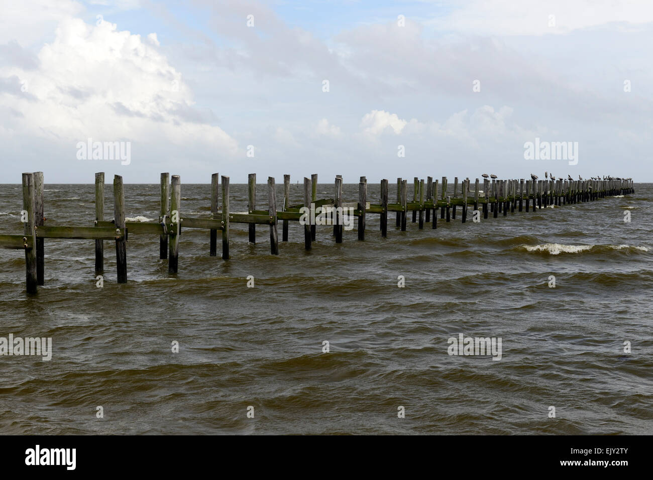 washed out wrecked storm damaged wood wooden pier hurricane katrina reminder Biloxi gulf coast Mississippi RM USA Stock Photo