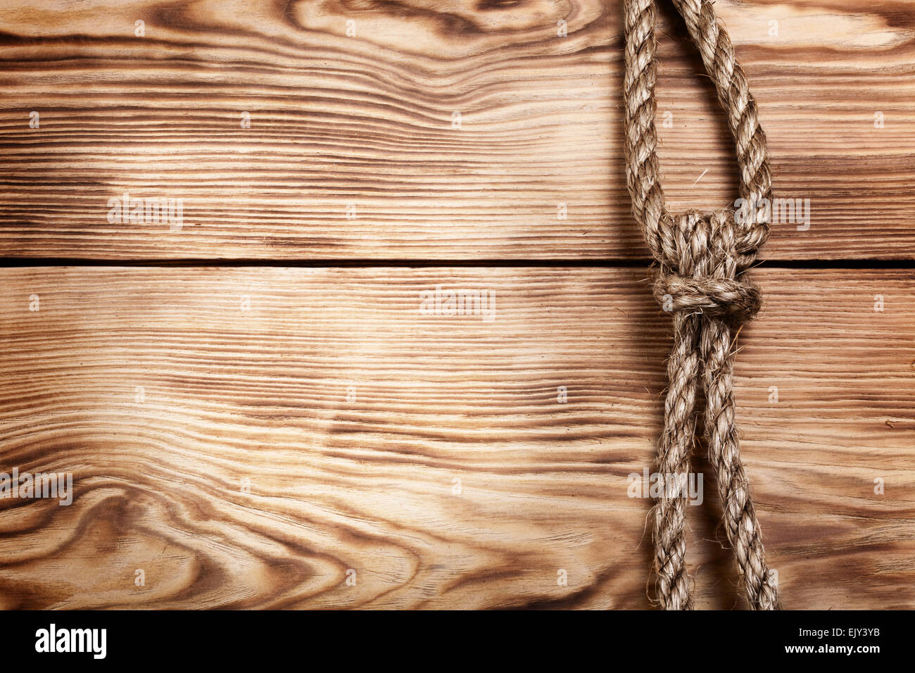 old rope on wooden boards for your design Stock Photo - Alamy