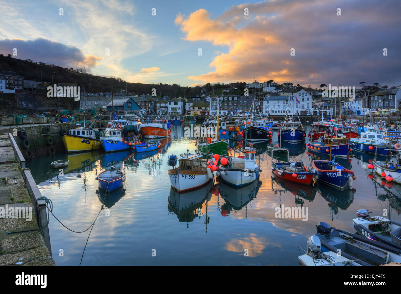 Boats in the inner harbour at Mevagissey on the south coast of Cornwall, captured at sunset. Stock Photo