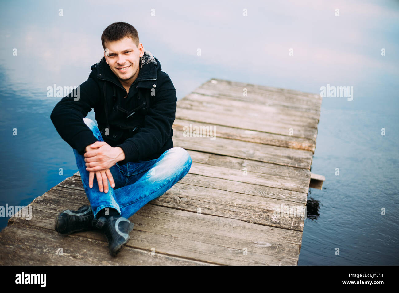 Sad pensive man sitting river hi-res stock photography and images - Alamy
